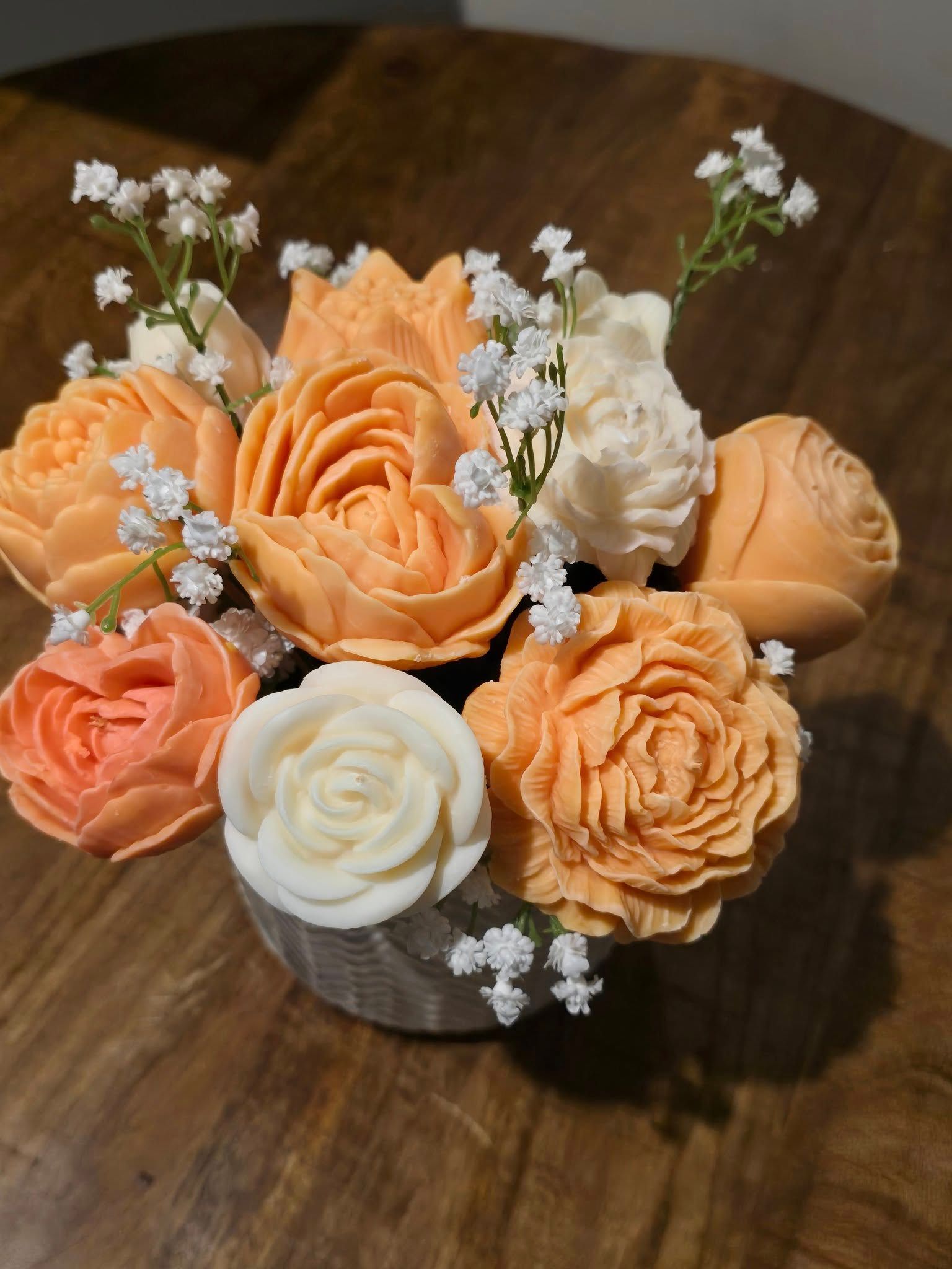 Peach rose candle bouquet overhead view
